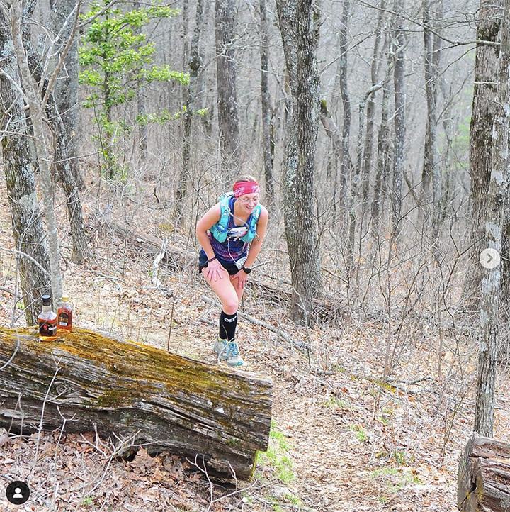 woman running through the woods