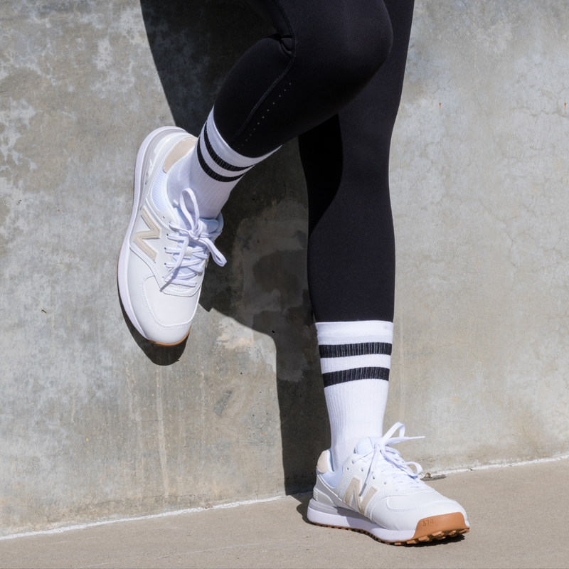 Person wearing os1st wicked comfort socks crew white with black stripes | OS1st