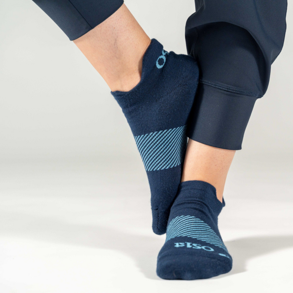 Woman wearing new wicked comfort sock in navy | OS1st