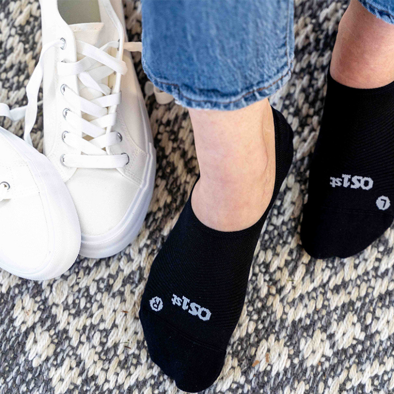 Woman wearing black nekkid comfort socks with sneakers | OS1st