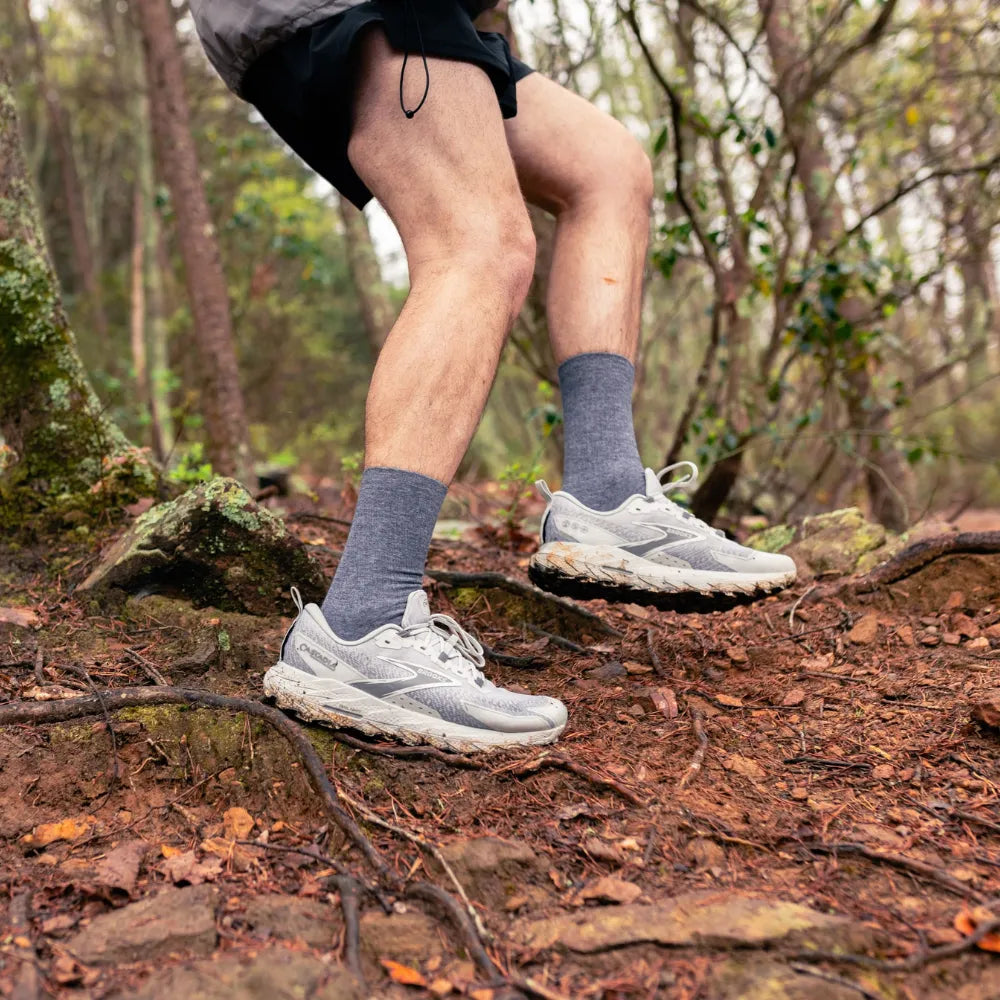 trail runner wearing merino wool wicked comfort socks, crew in grey | OS1st
