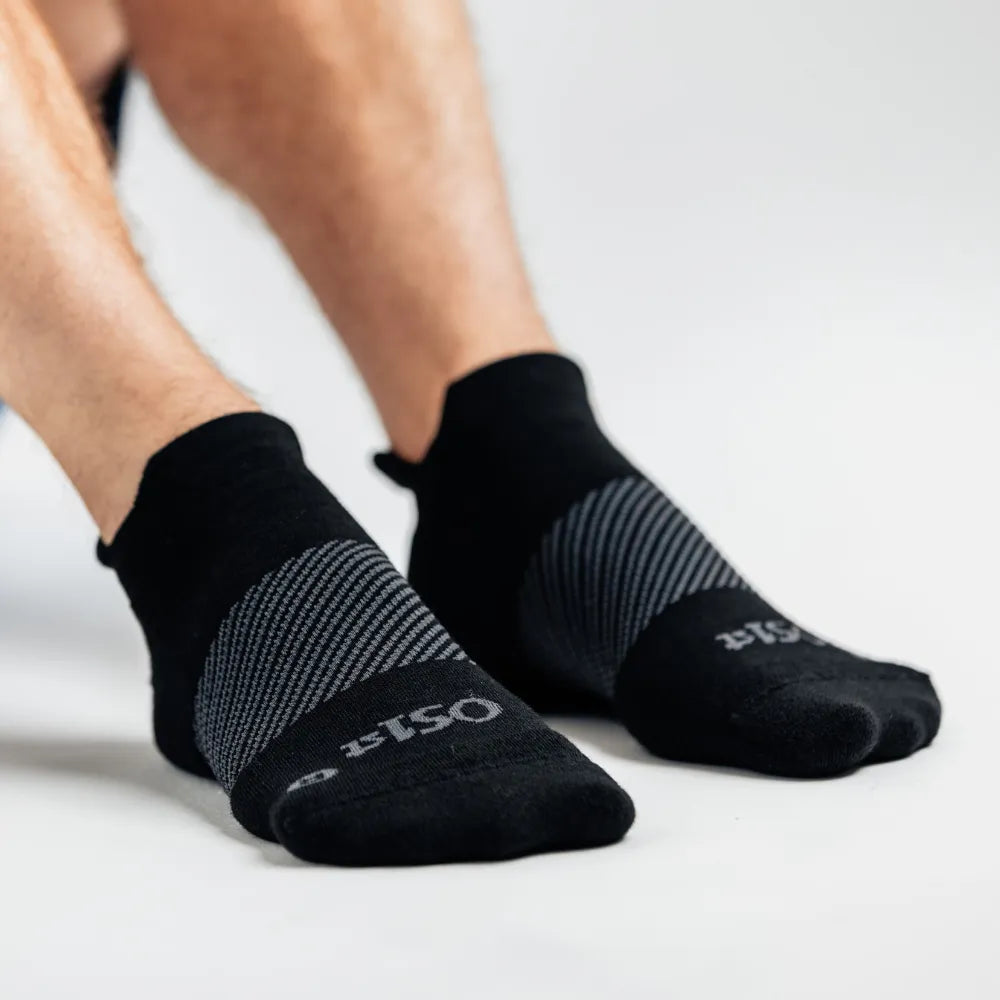 model wearing merino wool wicked comfort socks, no show in black | OS1st
