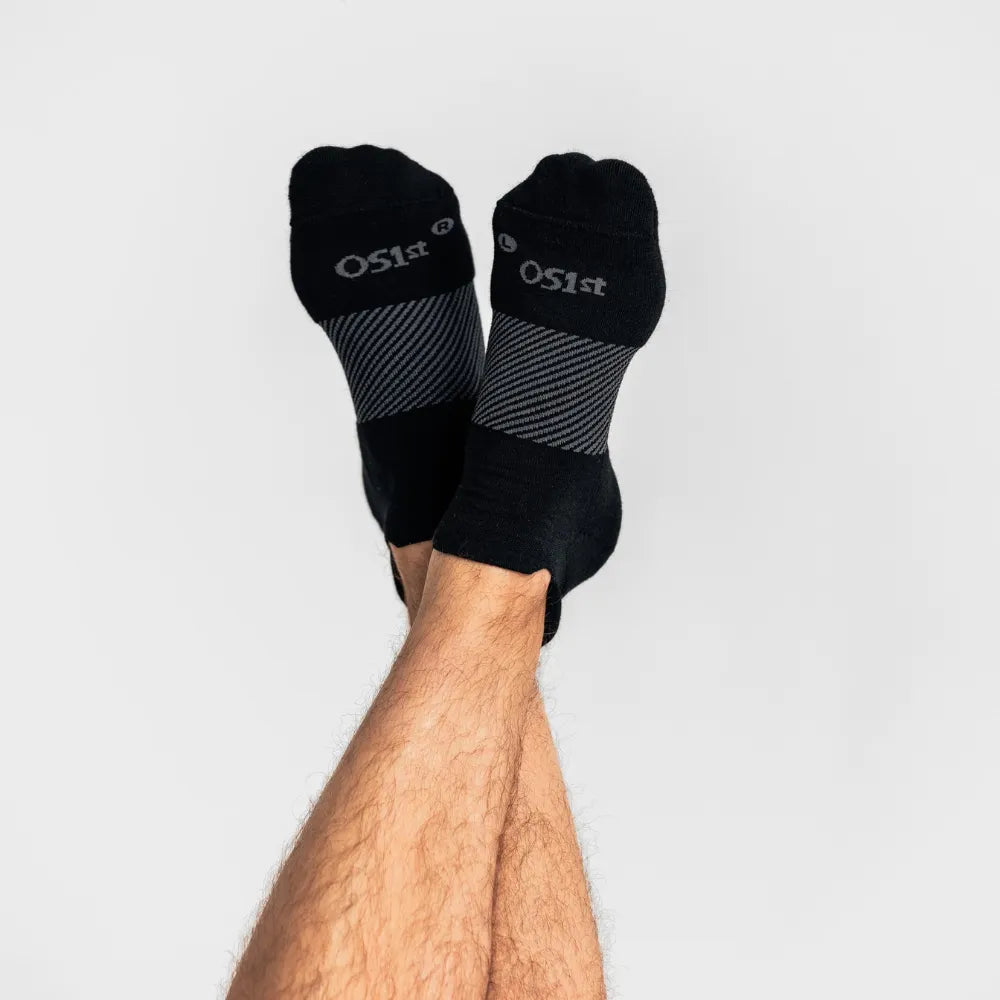 model wearing merino wool wicked comfort socks, no show in black | OS1st