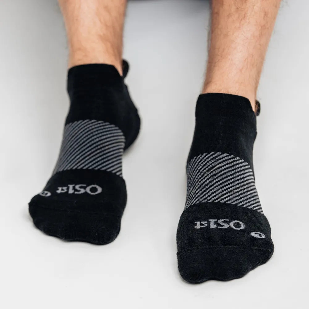 model wearing merino wool wicked comfort socks, no show in black | OS1st