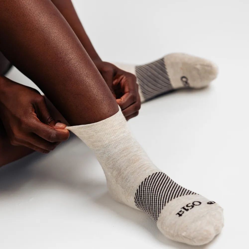 model wearing merino wool wicked comfort socks, quarter crew in mushroom | OS1st