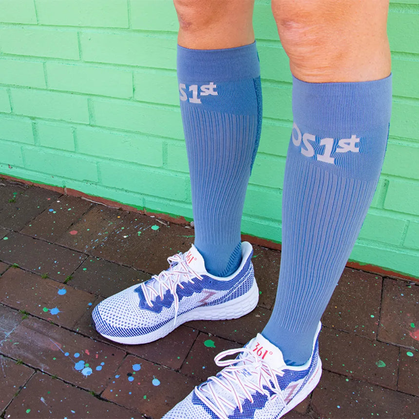 Person wearing steel blue compression bracing socks | OS1st