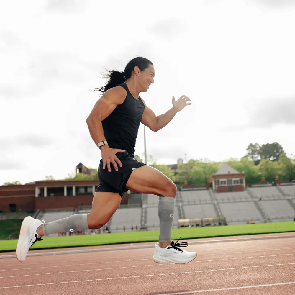 athlete wearing grey thin air performance socks and sleeves | OS1st