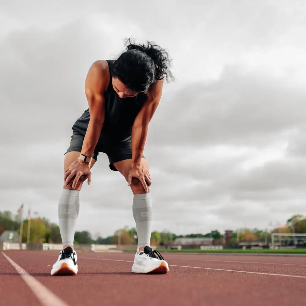 athlete wearing thin air performance socks and sleeves in grey | OS1st