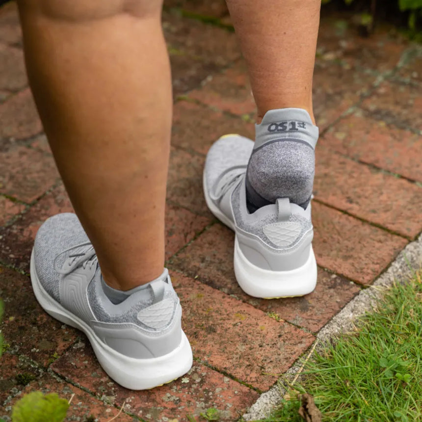 woman wearing grey no show wellness performance socks | OS1st