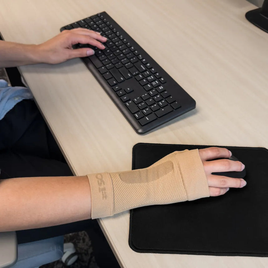 #color_tan
person wearing ws6 wrist sleeve while working | OS1st