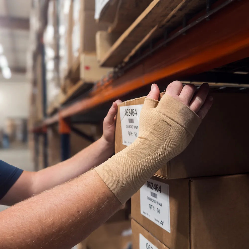 #color_tan
warehouse worker wearing tan ws6 wrist sleeve | OS1st