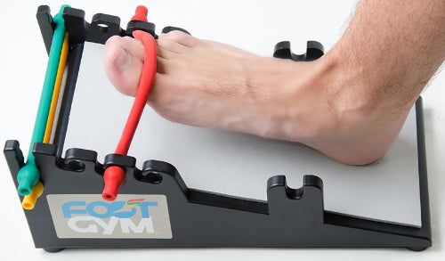 a person using the foot gym to exercise the foot