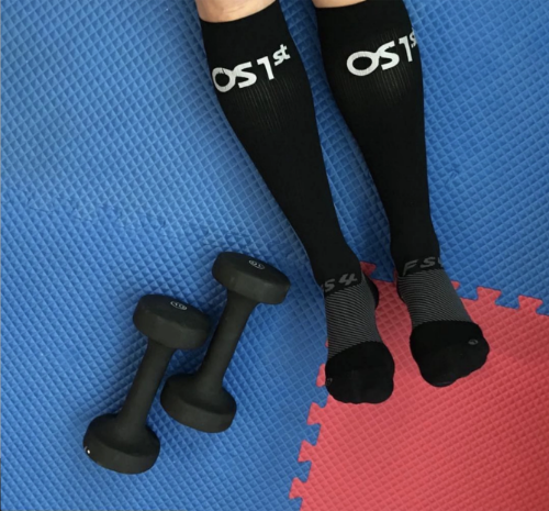a person wearing the FS4+ compression bracing socks in black | OS1st