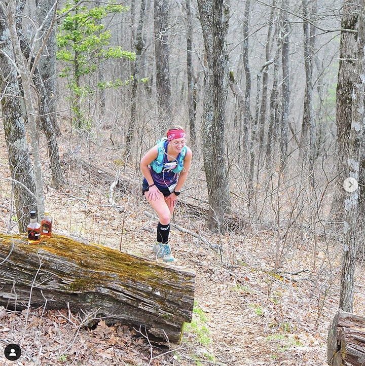 legs runner in compression calf sleeve running over stones Stock