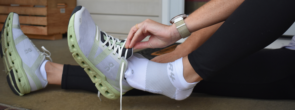 Runner wearing the OS1st Bunion Relief Socks in white | OS1st