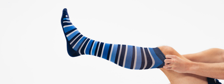 man wearing blue, white and navy striped compression socks | OS1st