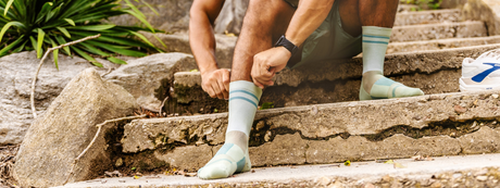 man wearing green burst crew thin air performance socks | OS1st
