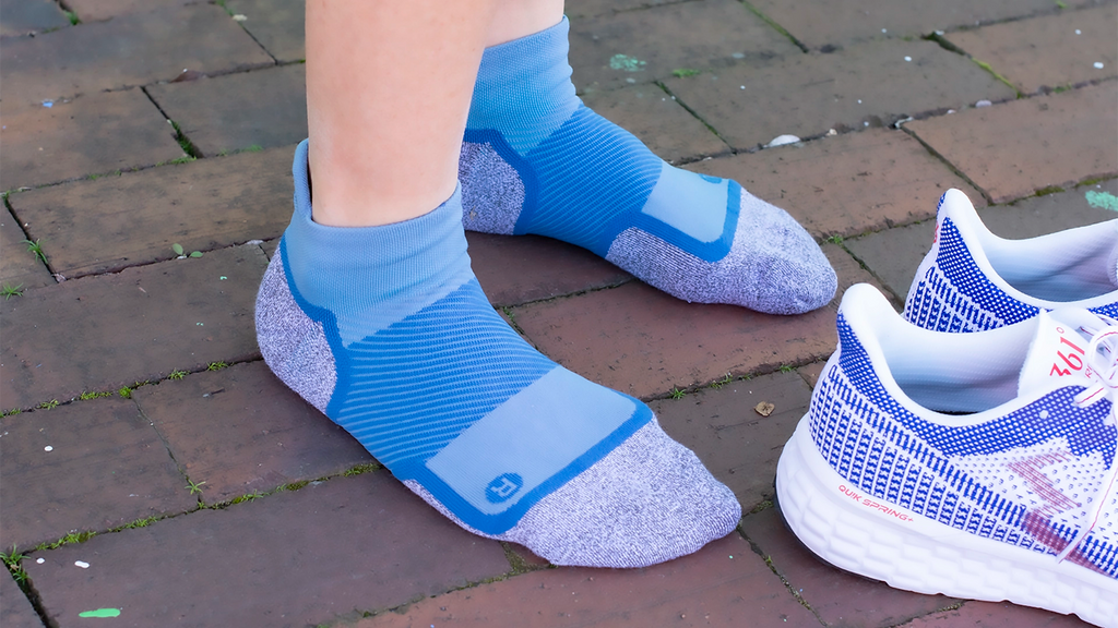 Person wearing WP4 wellness performance socks in blue | OS1st