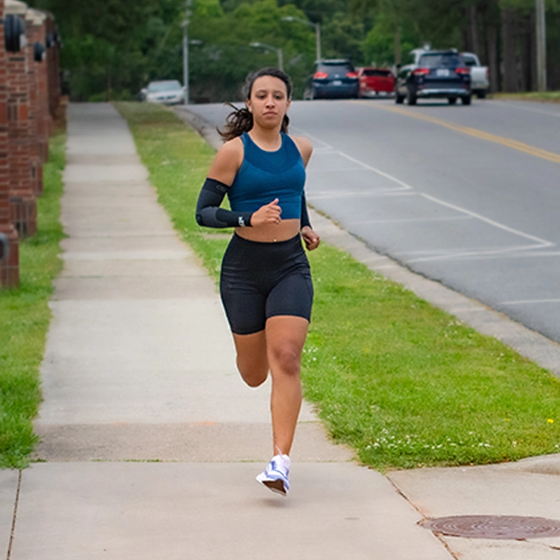 Woman running wearing performance socks for runners | OS1st