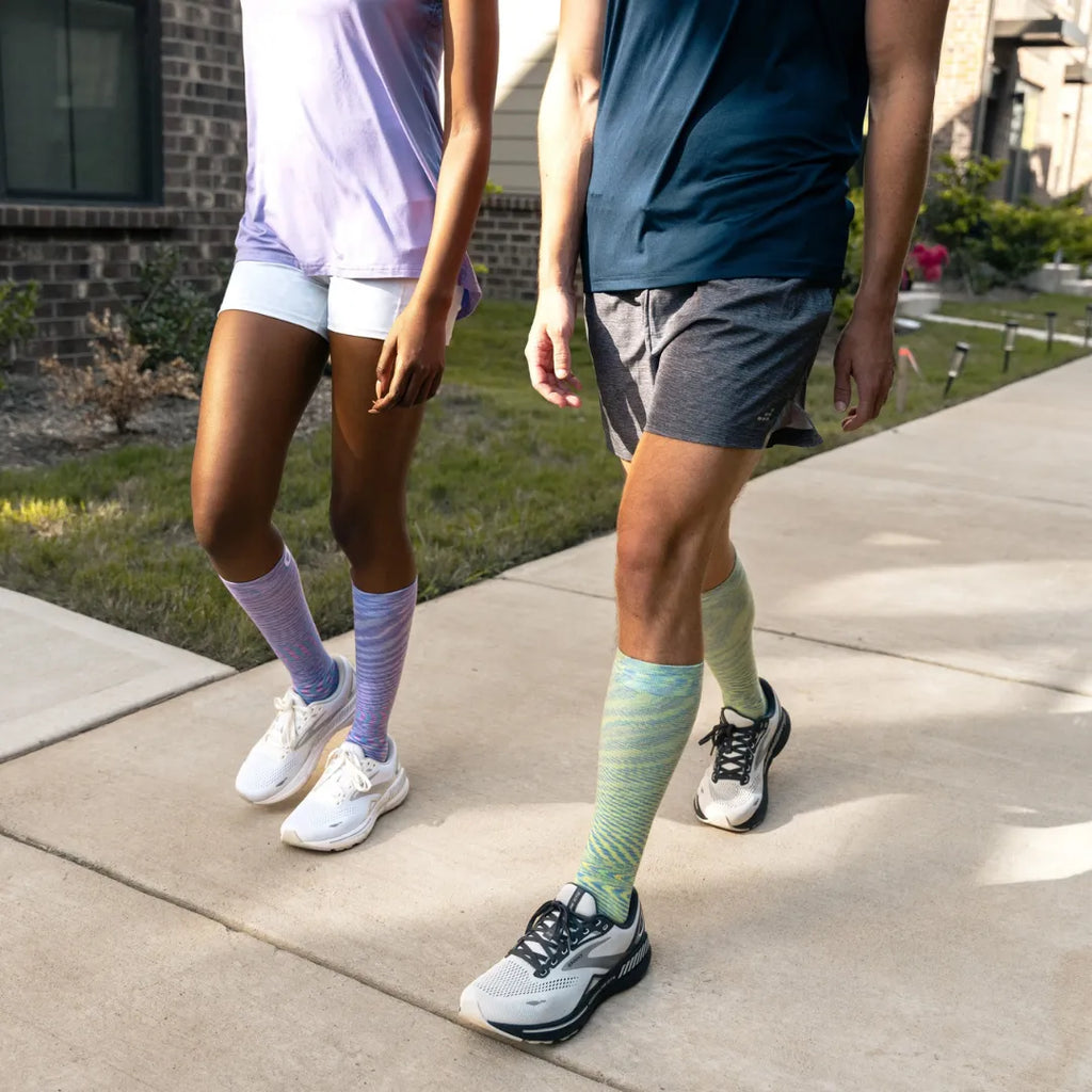 pair wearing galaxy and nebula wellness compression socks | OS1st