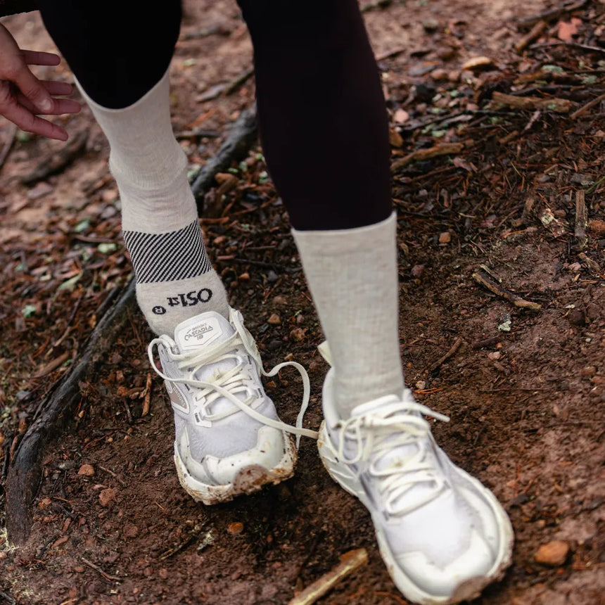hiker wearing merino wool wicked comfort socks, crew in mushroom | OS1st