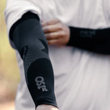 Person wearing black as6 arm sleeves on a trail run | OS1st