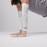 Person wearing white as6 arm sleeves while doing push ups | OS1st