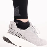 bottom back of cs6 calf sleeves showing compression zones and pairing with active comfort socks | OS1st