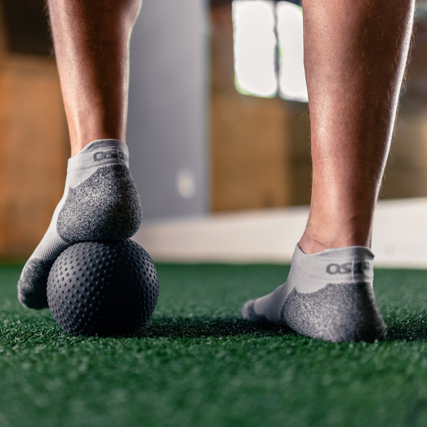 man wearing grey dermasox while doing recovery exercises | OS1st