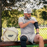Pickleball athlete wearing es6 elbow brace and KS7 knee sleeve | OS1st