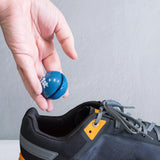 person dropping fresh snaps into athletic shoe | OS1st