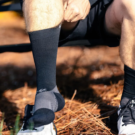 Runner wearing black crew plantar fasciitis socks | OS1st
