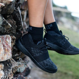 Person wearing black plantar fasciitis socks in quarter crew | OS1st