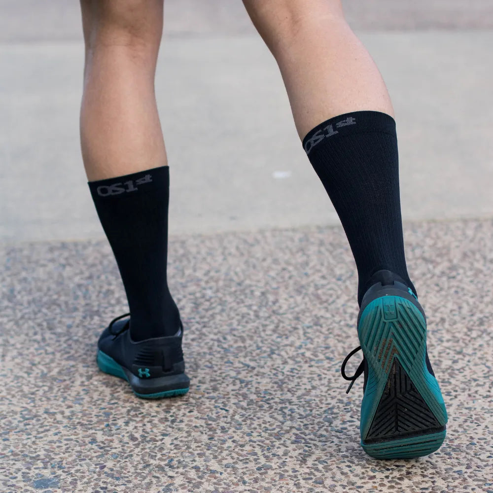 runner wearing wellness performance socks | OS1st