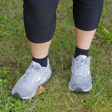 woman wearing black quarter crew wellness performance socks | OS1st
