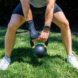 #color_black
man lifting weights wearing black ws6 wrist sleeve | OS1st