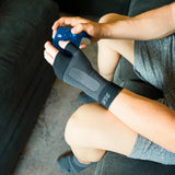 #color_black
person wearing ws6 wrist sleeve while playing video games | OS1st