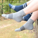 person wearing quarter crew wicked comfort socks in charcoal | OS1st