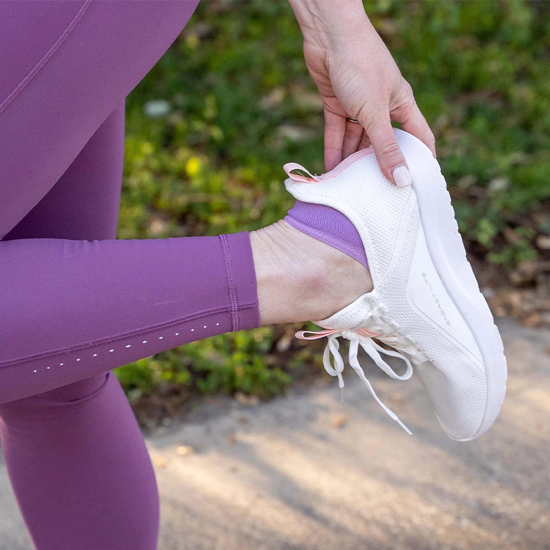Woman wearing Nekkid Comfort sock in lavender with running shoes | OS1st