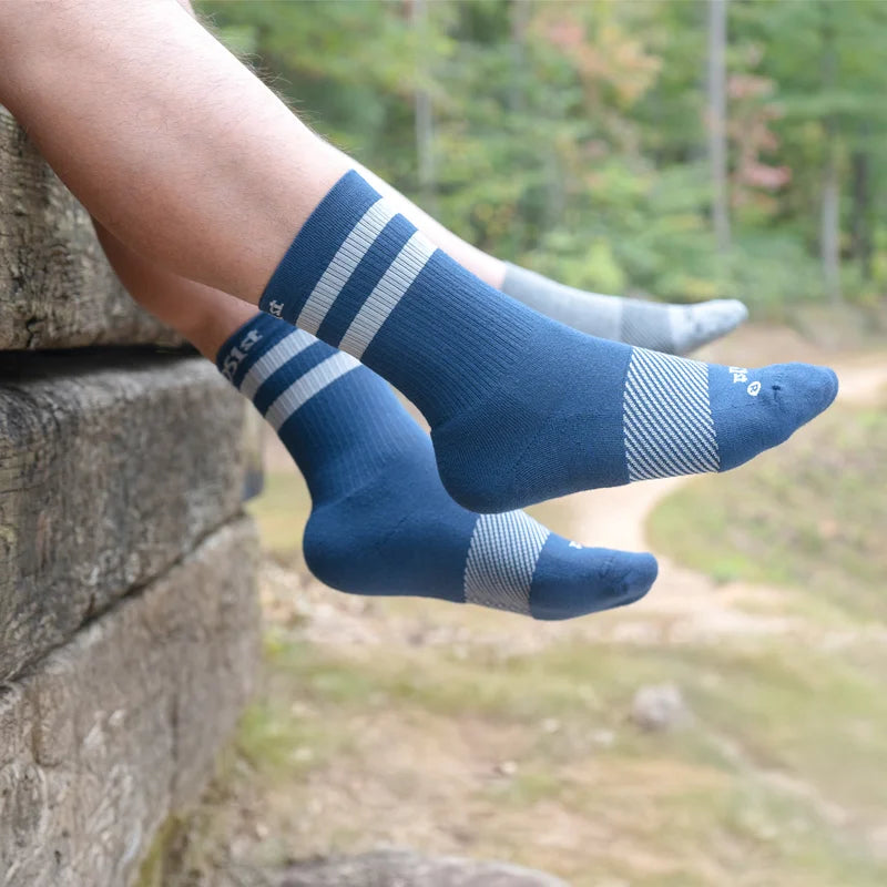 Man wearing navy with silver stripes crew wicked comfort sock | OS1st