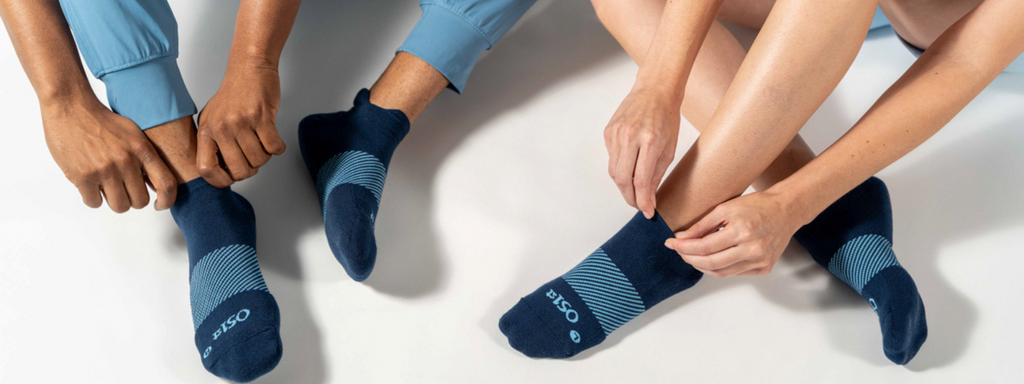 Man and woman wearing new Wicked comfort socks in navy | OS1st