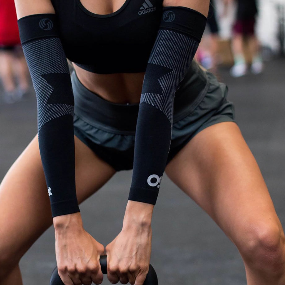 Why do marathon runners wear arm sleeves?