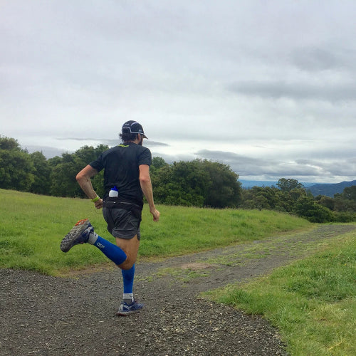 a man running while wearing the CS6 performance calf sleeves | OS1st