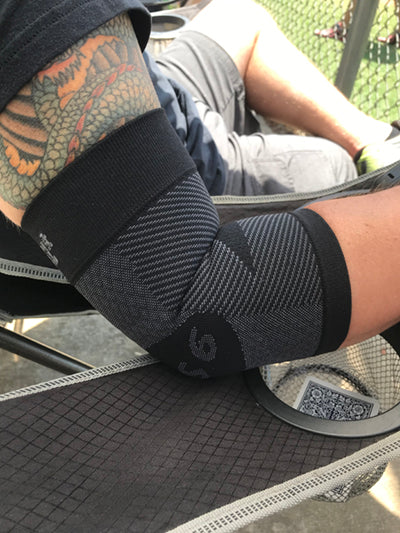 person wearing the ES6 elbow bracing sleeve | OS1st