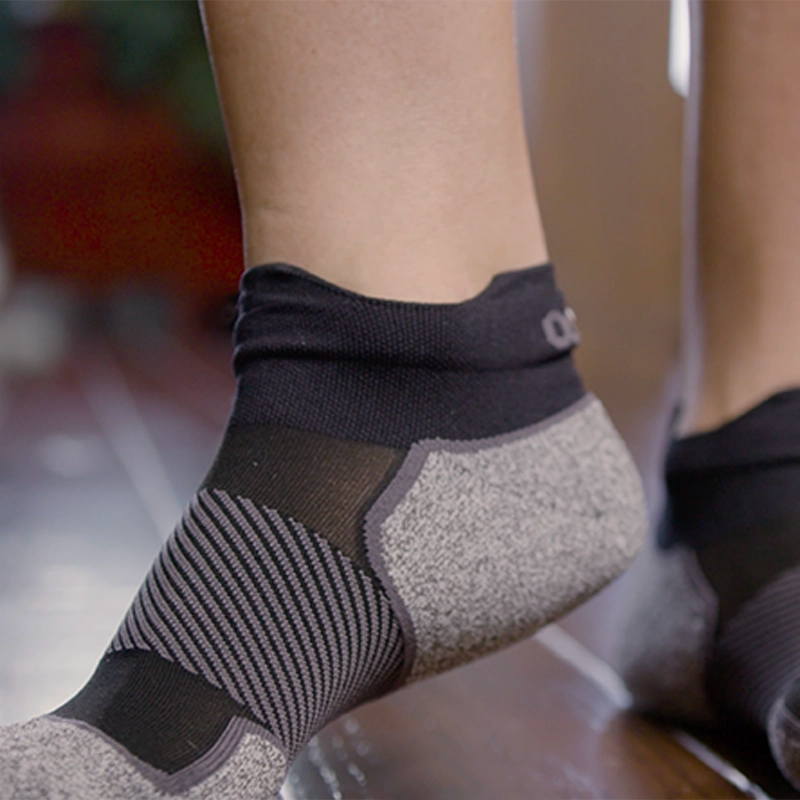 Person wearing the AC4 Active Comfort Socks no show length in black | OS1st