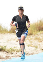 a woman running while wearing the PS3 performance patella sleeve | OS1st